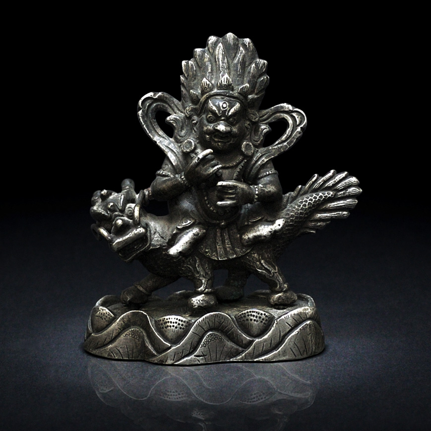 A JAMBHALA FIGURE IN SILVER ALLOY, TIBET 19TH