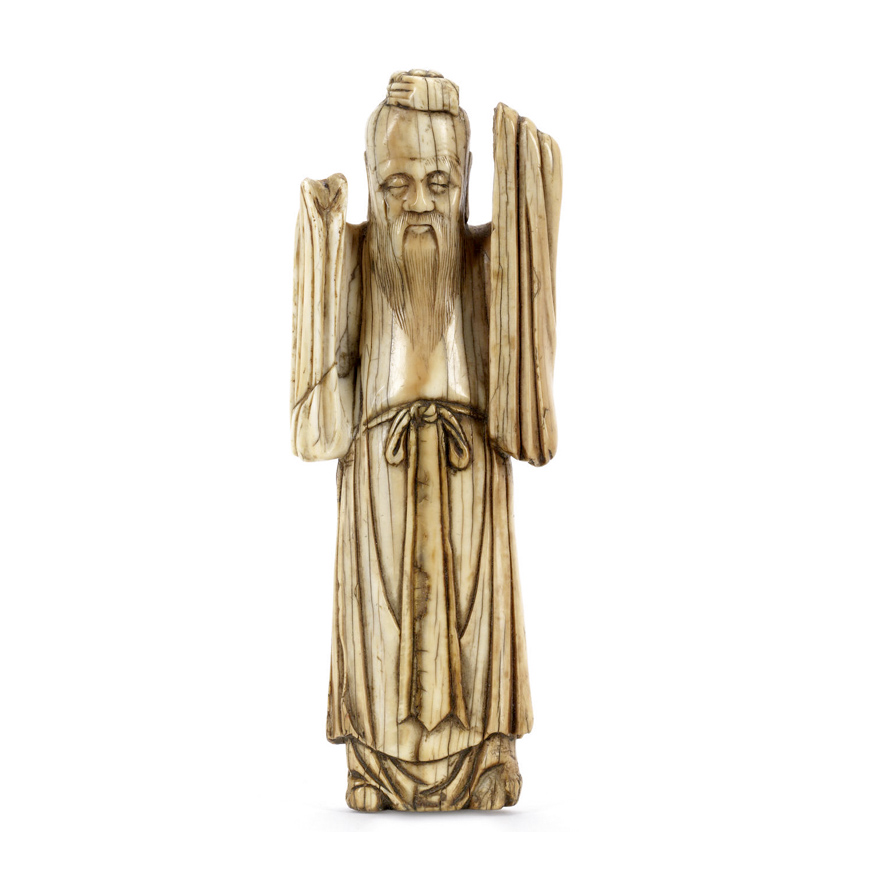 AN IVORY FIGURE OF AN IMMORTAL, MING DYNASTY-16TH CENTURY