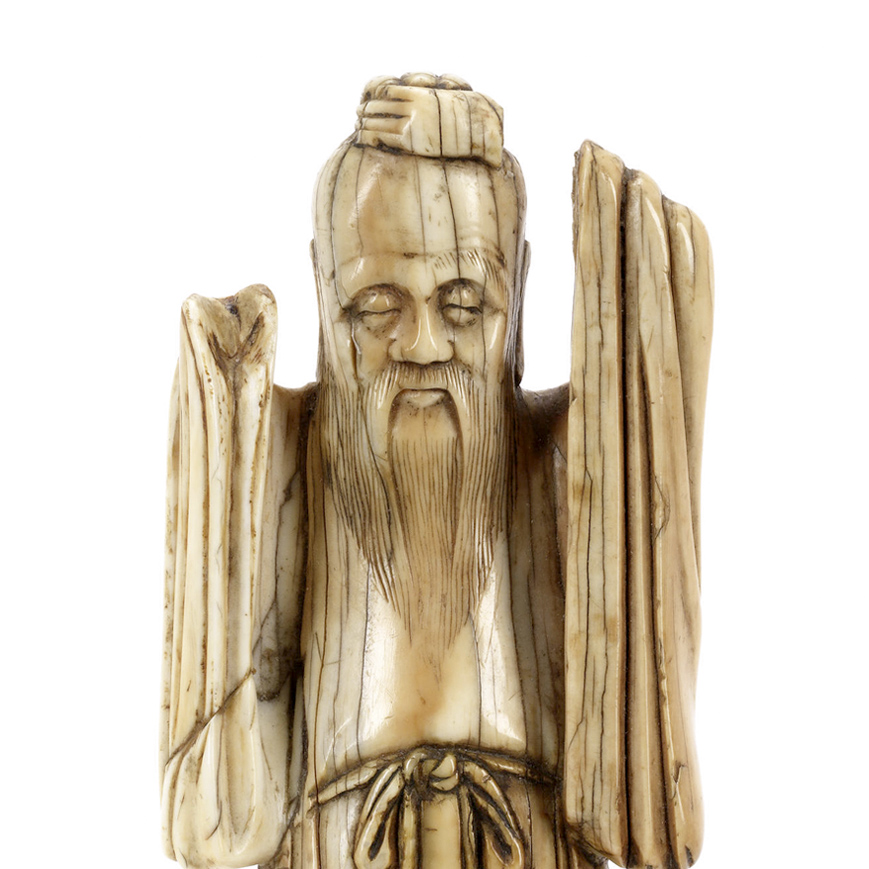 AN IVORY FIGURE OF AN IMMORTAL, MING DYNASTY-16TH CENTURY