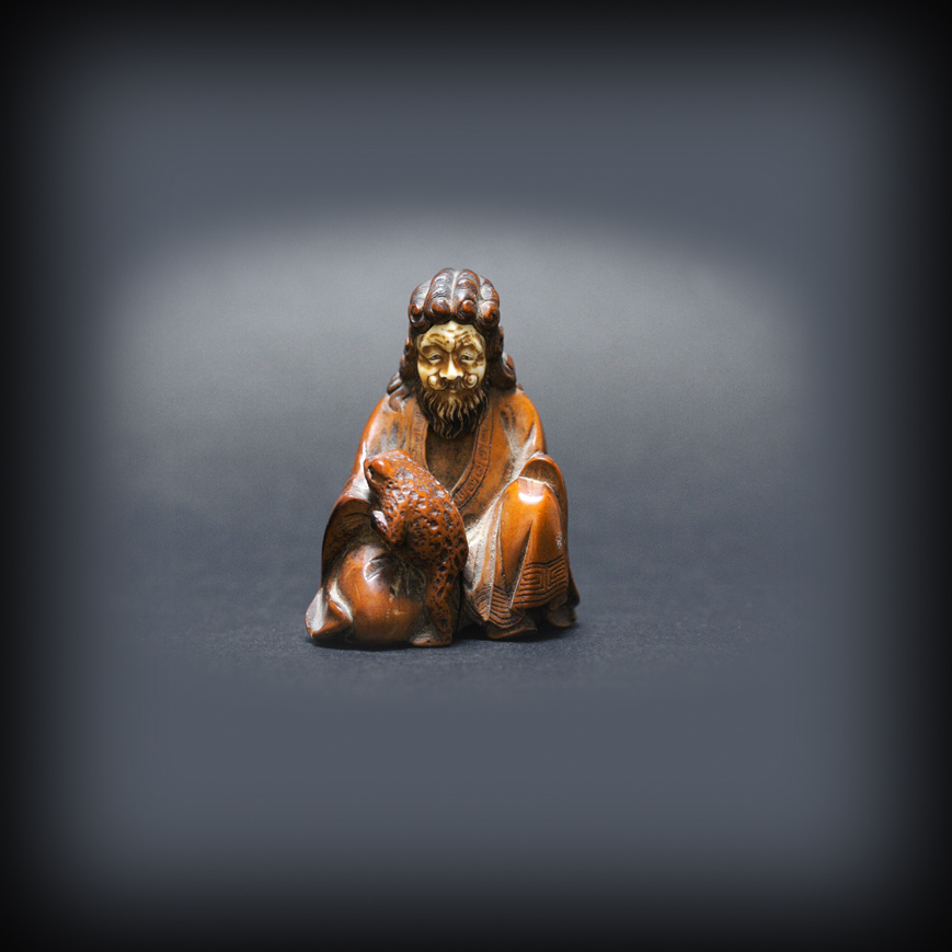 A LITTLE OKIMONO FIGURE OF GAMMA SENNIN, LATE EDO 19TH CENTURY 