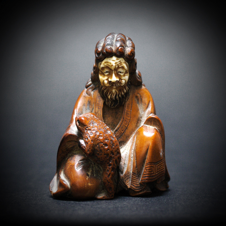 A LITTLE OKIMONO FIGURE OF GAMMA SENNIN, LATE EDO 19TH CENTURY 