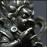 A JAMBHALA FIGURE IN SILVER ALLOY, TIBET 19TH